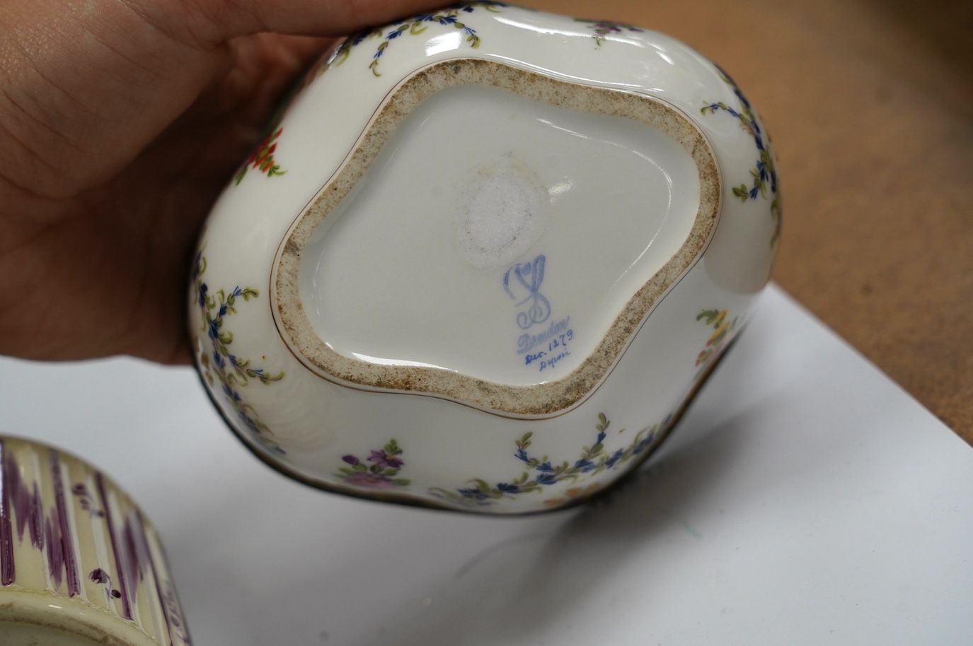 A Dresden porcelain ink stand, 11cm high, and an 18th century English creamware tea caddy with a silver lid, 10cm high. Condition - fair to good